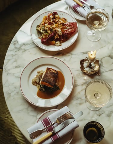 Elegant fine dining experience at Don't Tell Dad, London, featuring gourmet dishes and wine pairings