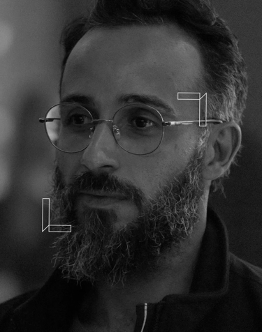 a man with a beard and glasses on his face