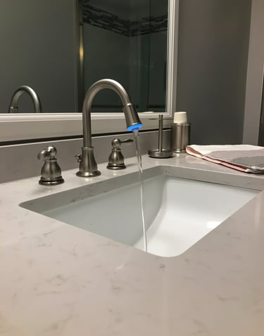 a sink with a faucet and a towel