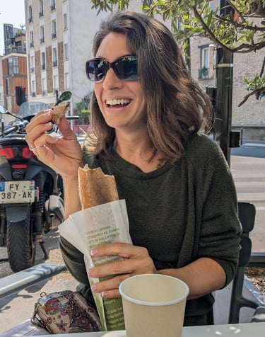 Photo of Danielle eating baguette in Paris