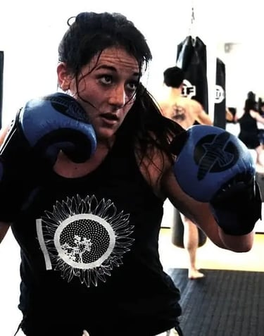 Veronica looking at a target as she prepares to throw a punch.