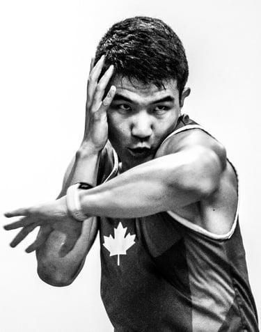 Qianshu has one hand up and his left elbow is striking forward.