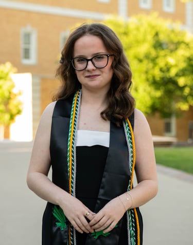 Girl Standing in Graduation Regalia
