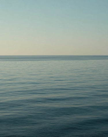 Cinematic photography of the horizon over a calm sea from a high vantage point, with elegant soft blue and sage tones reflecting the brand's palette.