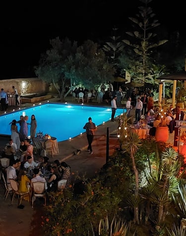 a pool with people standing around a pool