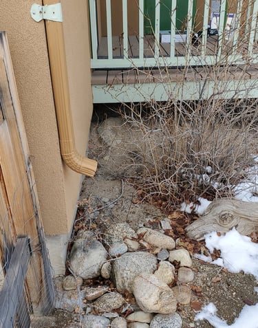 This downspout just dumps the water right next to the foundation. 