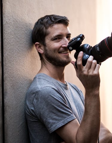 Product photography - a man holding a camera and taking a picture