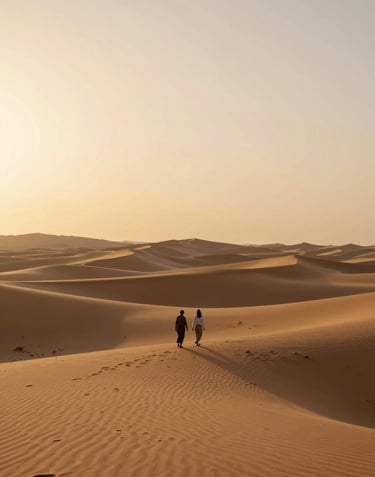 Atmospheric wide shot of a desert landscape at golden hour, a lone couple walking, cinematic colors #AD7B5B and #FDF8F0.