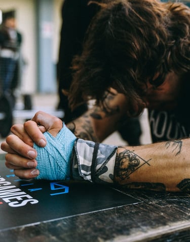 a man with tattoos on his arm and arm