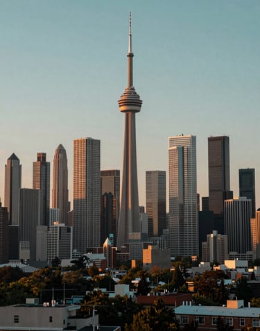 A wide shot of a modern city skyline at dawn, showcasing a range of iconic North American skyscrapers and development projects in muted teal and gold light.
