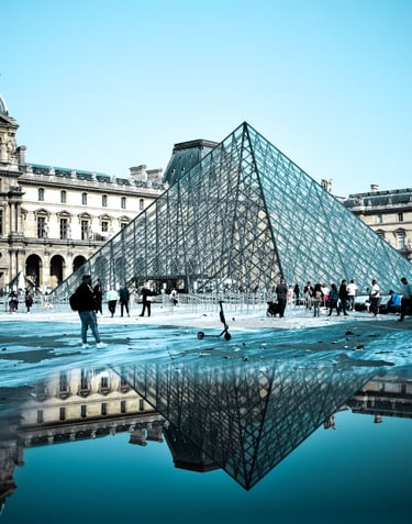 Paris France ,a large glass pyramid with a pyramid shaped structure