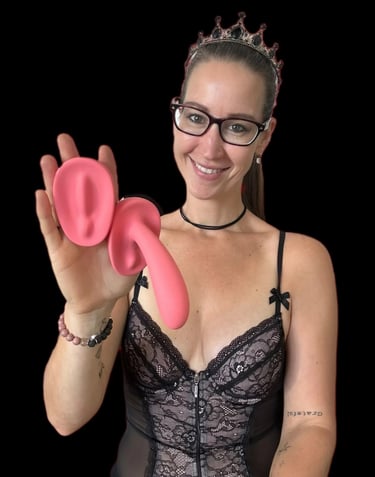 Pleasurelit Patricia holding the arosum vibrators for a review
