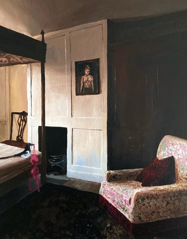 a bedroom with a bed and a chair. magpie sits on th ebed holdig a bra