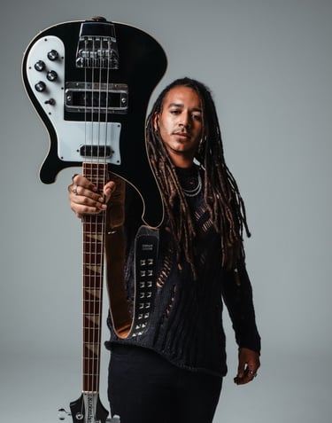 a bass player with dreadlocks and a bass