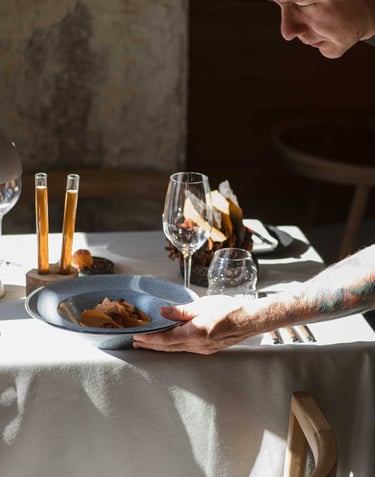 a man is holding a plate with food on it