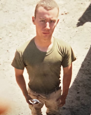 A fatigued Marine in Iraq, 2003, after months of intense combat deployment. The visible weight loss 