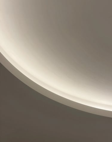 Minimalist architectural detail of a curved concrete ceiling, soft diffuse light, ethereal atmosphere, sand and charcoal tones #F9F7F2 #333333