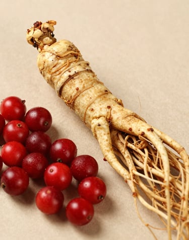 A woman over 40 enjoying a calm moment in her kitchen with CitrusBurn bottle and a cup of tea nearby.