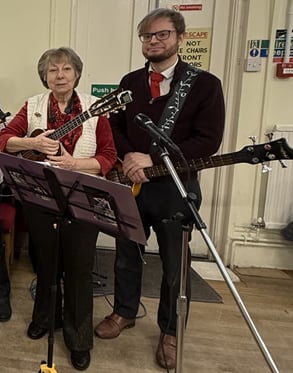 Ukuladies playing at Christmas time with our guest bassist
