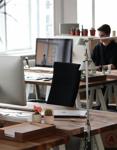 Modern office workspace with computer stations representing IT support and managed services by TotalScope Technologies