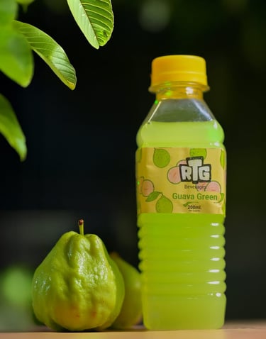 a bottle of fruit juice with a pear tree in the background