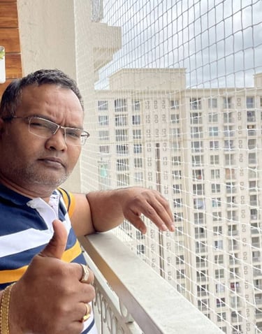 Satisfied homeowner with balcony pigeon net installation in Electronic City Bangalore