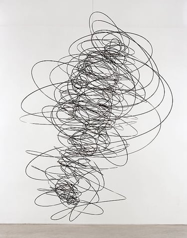 a large black and white sculpture os oscilation