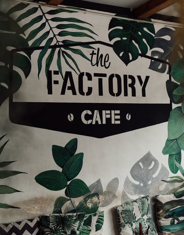 a wall mural of a plant life in a cafe