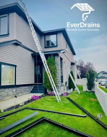 Professional gutter installation by EverDrains team on a residential house in Calgary