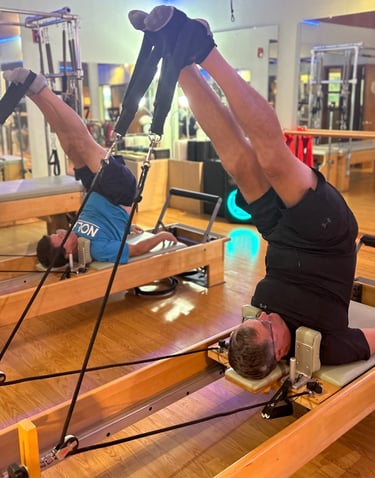 two men doing pilates