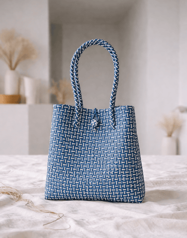 Handwoven blue striped plastic tote bag handmade from recycled materials by Indonesian artisans