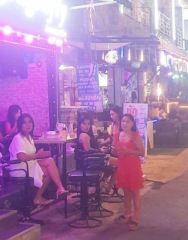 Thai women outside bar on soi Bintabaht, Hua Hin in Thailand