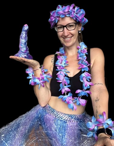 Pleasurelit Patricia holding the Selene Moon Goddess Dildo for a review