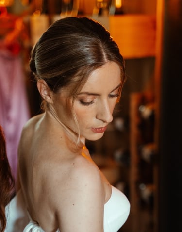a woman in a white dress and natural make up for her wedding