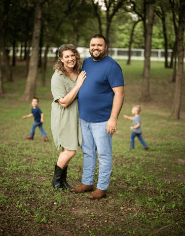 Photo of the Gigl family with trees in the background