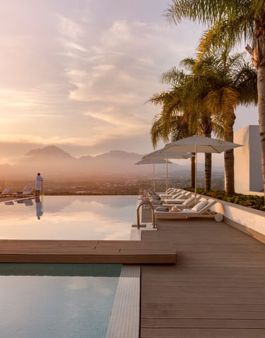a luxury resort infinity pool with expansive mountain views