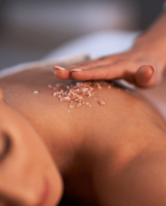 a woman getting a massage at a spa