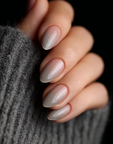 Neutral taupe almond nails with glossy minimalist finish