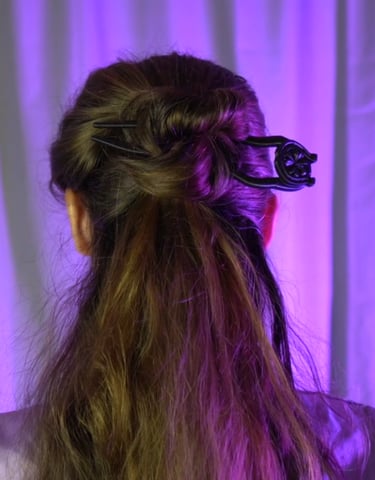 a woman with long hair and a hair comb