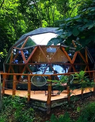 a dome shaped tenter with a patio table and chairs