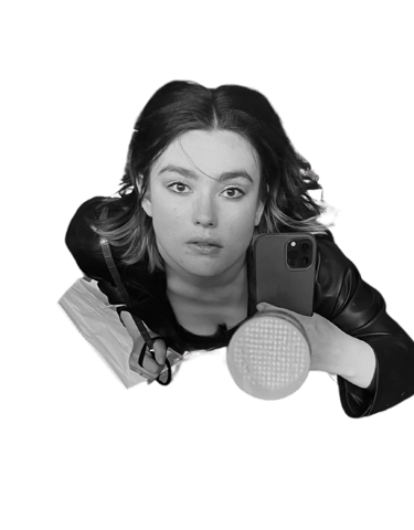 a woman holding her iphone taking a selfie