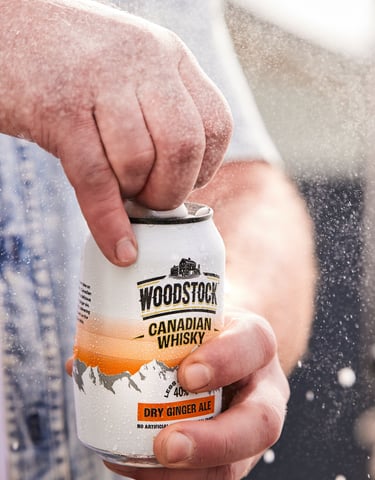 Product photography - a man holding a can of woodstock