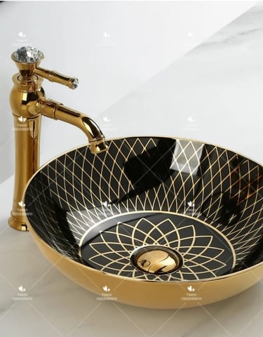 a bathroom sink with a gold sink and a faucet faucet