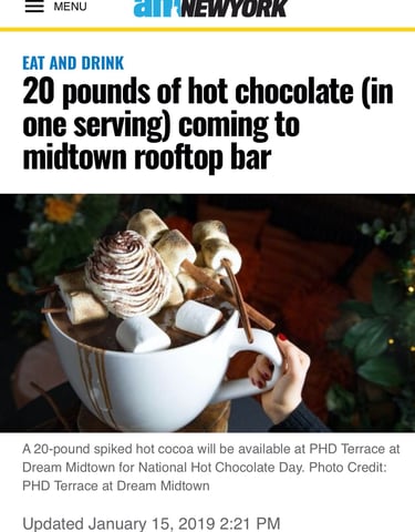 a person holding a cup of coffee and a cup of coffee