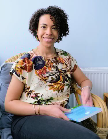 Miriam Lewis seated in therapy room