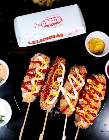 a bunch of food on a table with a box of ketchup