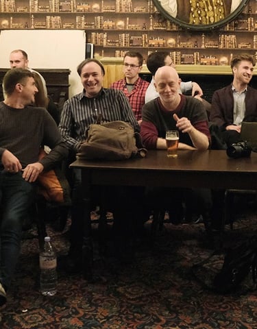 Members chat during the interval of a London Comedy Writers meeting