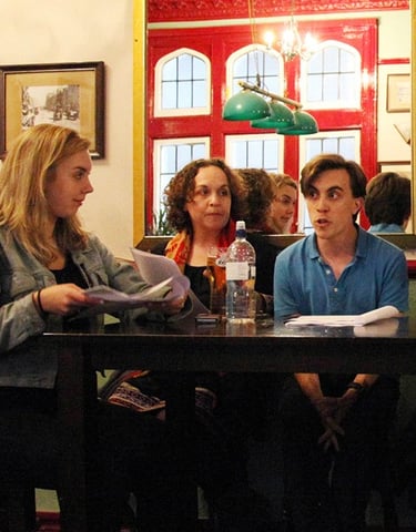 Actors performing a sitcom table read at a London Comedy Writers meeting