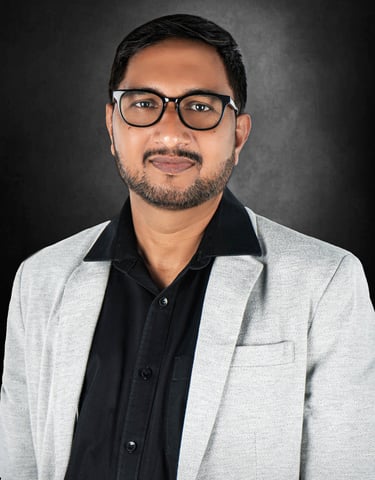 Well-lit corporate headshot capturing a poised entrepreneur with a sleek and professional background