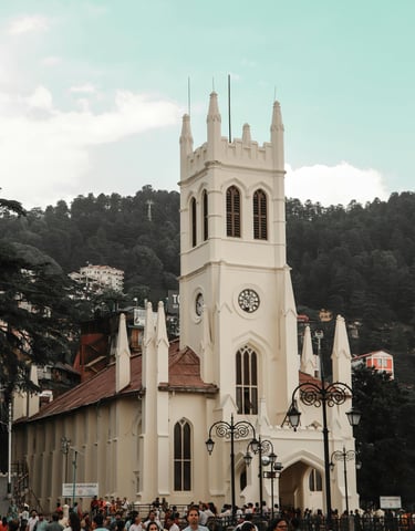 a church with a steeple and a clock tower